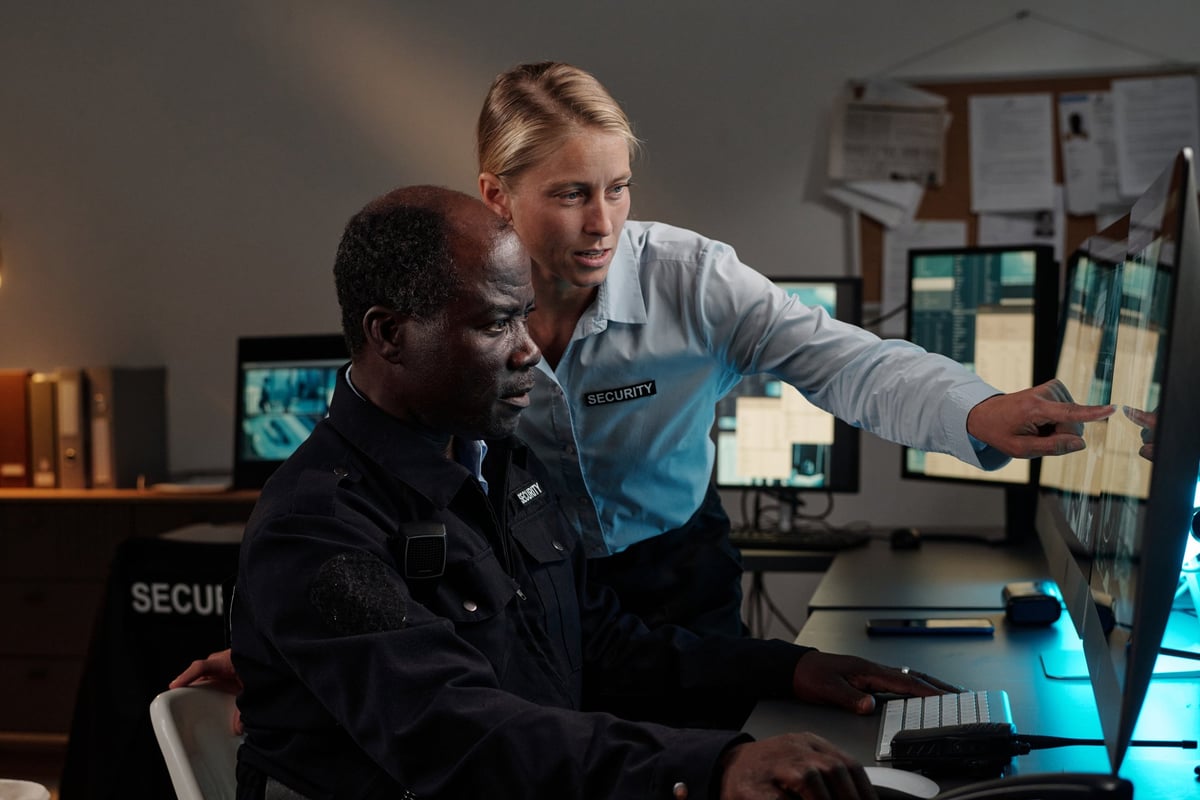 Security team monitoring screens